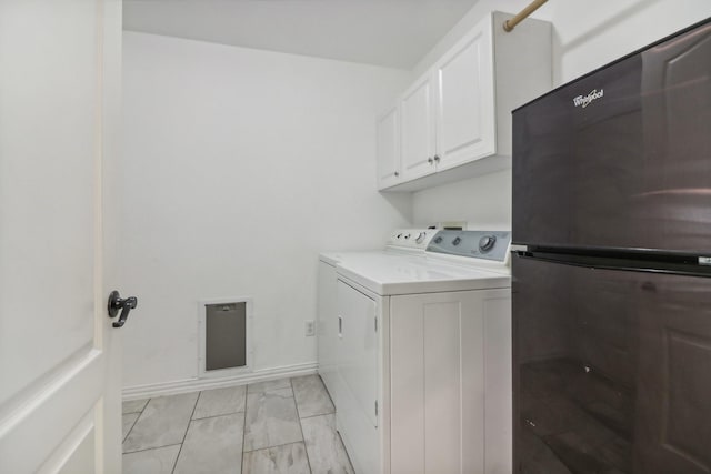 clothes washing area featuring baseboards, washing machine and dryer, cabinet space, and marble finish floor