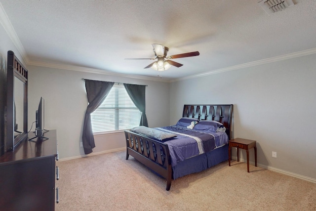 bedroom with a textured ceiling, ceiling fan, light colored carpet, and crown molding