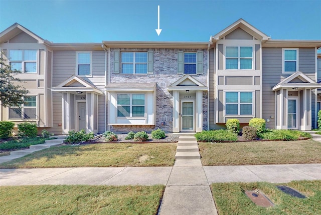 view of property with a front lawn