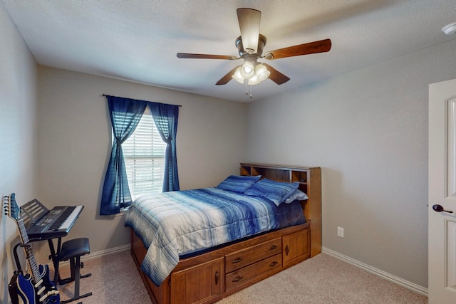 bedroom with ceiling fan and light colored carpet