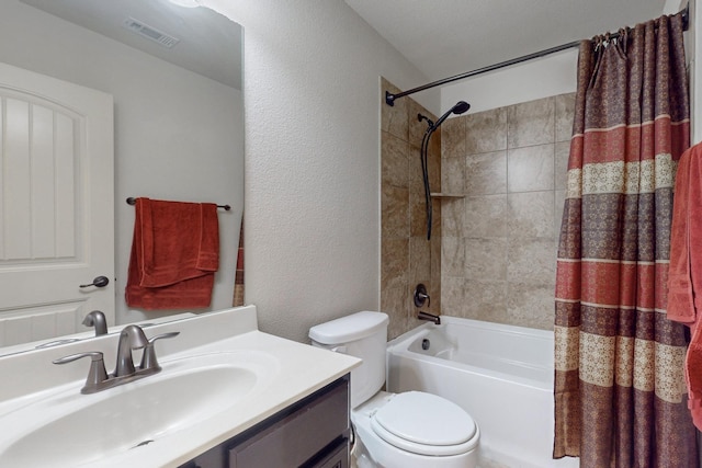 2924 Peyton Brook Dr, Fort Worth, TX 76137 - full bath featuring visible vents, shower / tub combo with curtain, a textured wall, vanity, and toilet