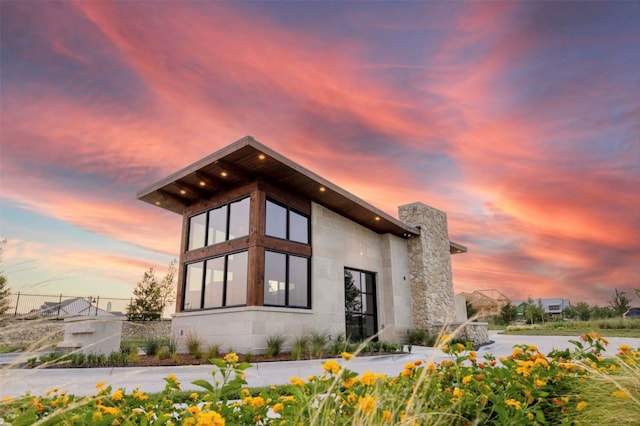 view of property exterior at dusk