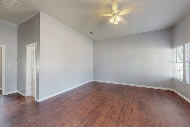 spare room with ceiling fan and dark hardwood / wood-style flooring