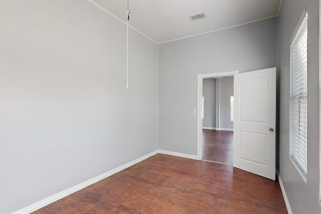 unfurnished room featuring dark hardwood / wood-style flooring