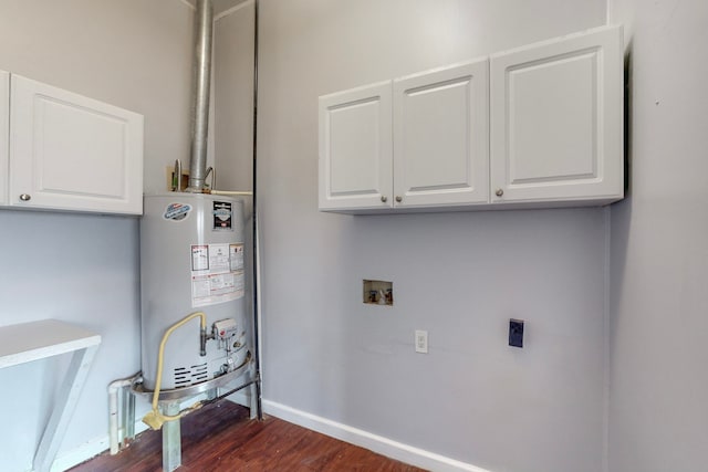 clothes washing area featuring hookup for a washing machine, dark wood-type flooring, electric dryer hookup, gas water heater, and cabinets