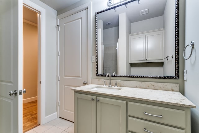 bathroom with vanity and hardwood / wood-style flooring