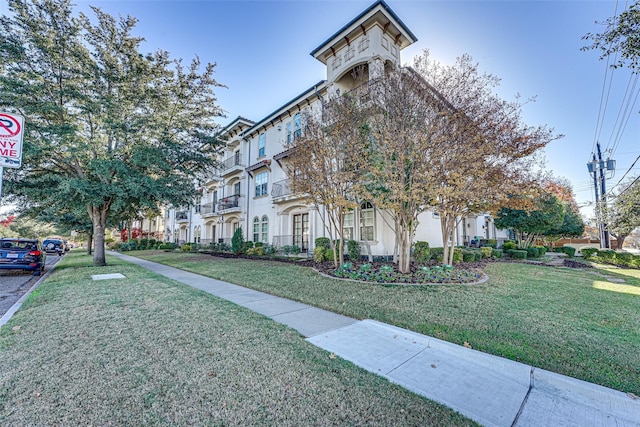 view of community featuring a lawn