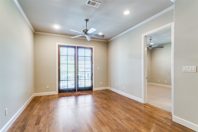 unfurnished room with ceiling fan, hardwood / wood-style flooring, and ornamental molding