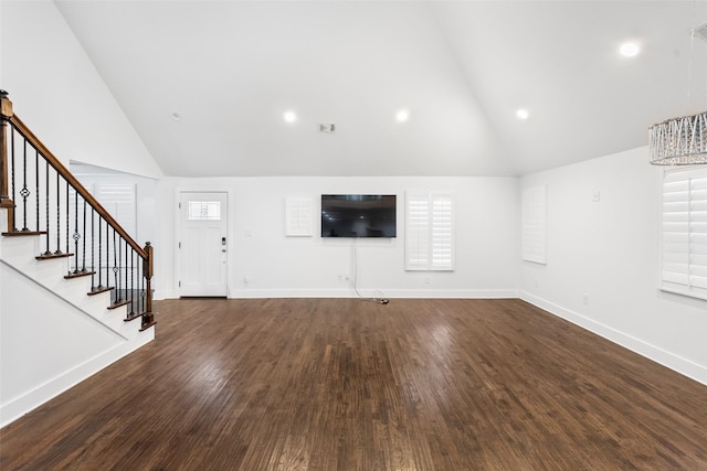 926 S Waverly Dr, Dallas, TX 75208 - unfurnished living room featuring high vaulted ceiling, stairs, wood finished floors, baseboards, and recessed lighting