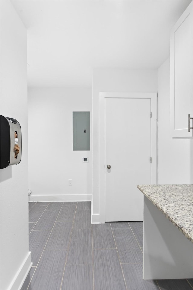 926 S Waverly Dr, Dallas, TX 75208 - corridor with electric panel, baseboards, and wood tiled floors