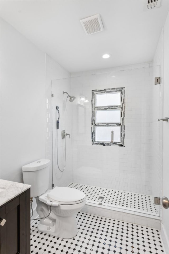 926 S Waverly Dr, Dallas, TX 75208 - full bath with toilet, a shower stall, vanity, tile patterned floors, and recessed lighting
