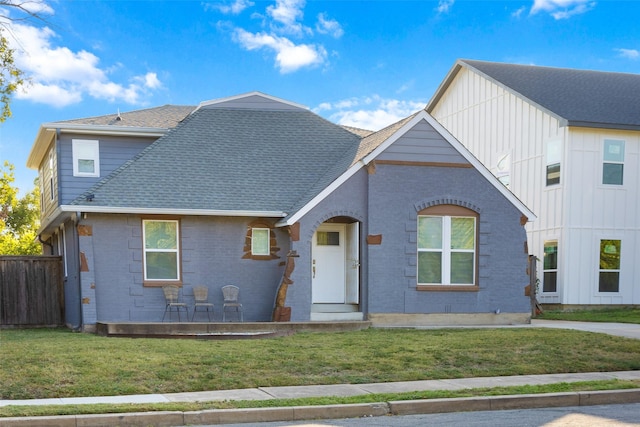 926 S Waverly Dr, Dallas, TX 75208 - view of front facade with brick siding, a shingled roof, and board and batten siding