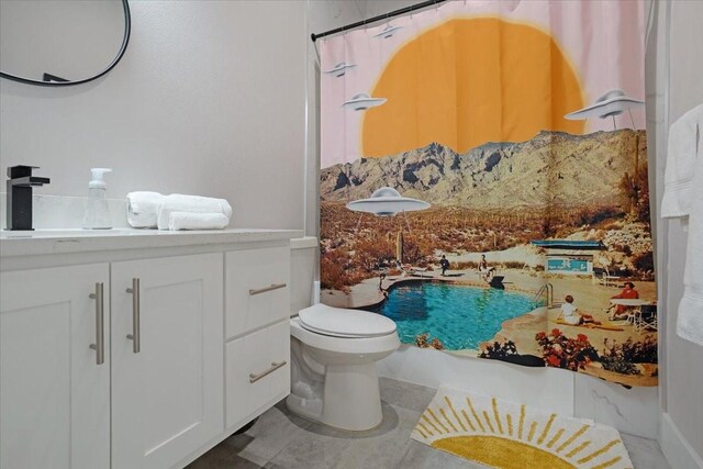 2604 Flora Ln, Denison, TX 75020 - bathroom featuring toilet, vanity, and curtained shower