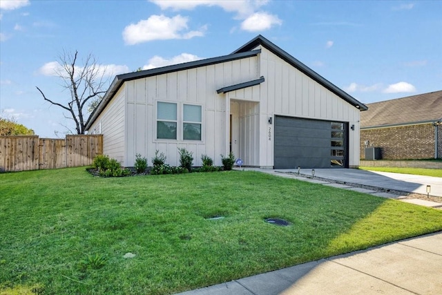 2604 Flora Ln, Denison, TX 75020 - view of front of property with concrete driveway, board and batten siding, and an attached garage