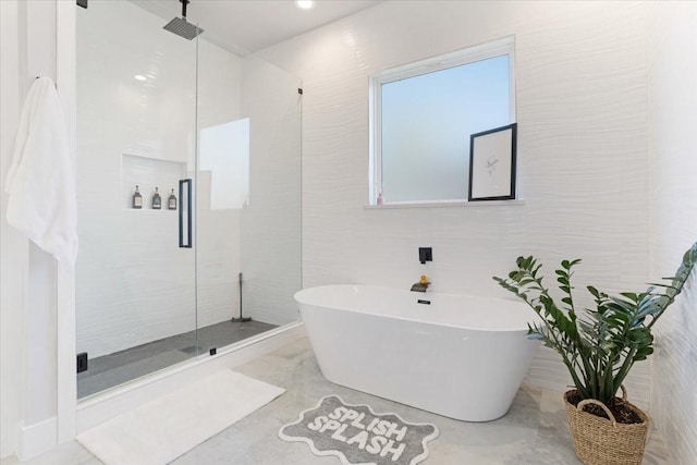 2604 Flora Ln, Denison, TX 75020 - full bath featuring a stall shower and a freestanding tub
