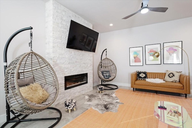 2604 Flora Ln, Denison, TX 75020 - sitting room featuring baseboards, a ceiling fan, a fireplace, and recessed lighting
