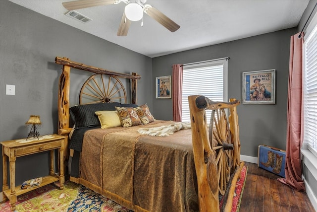 bedroom featuring dark hardwood / wood-style floors and ceiling fan