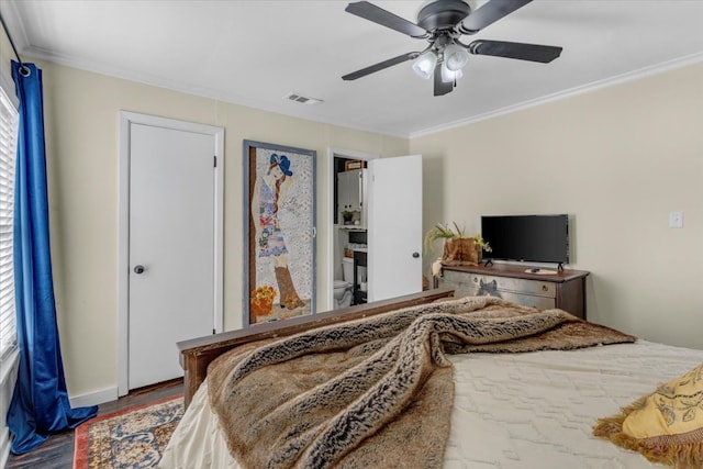 bedroom with hardwood / wood-style flooring, ceiling fan, and crown molding