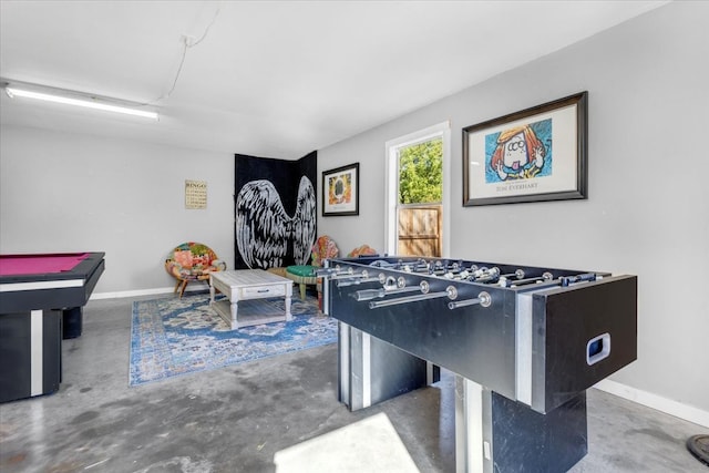 recreation room with pool table and concrete flooring