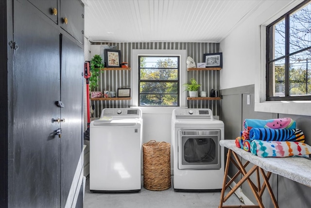 laundry area featuring cabinets and washer and clothes dryer