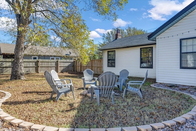 view of yard featuring a fire pit