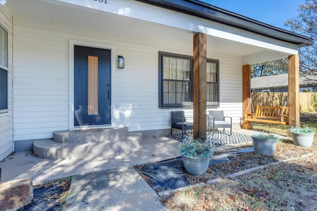 property entrance featuring covered porch