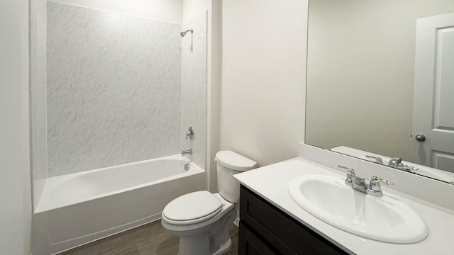 full bathroom with hardwood / wood-style floors, vanity, toilet, and shower / bath combination