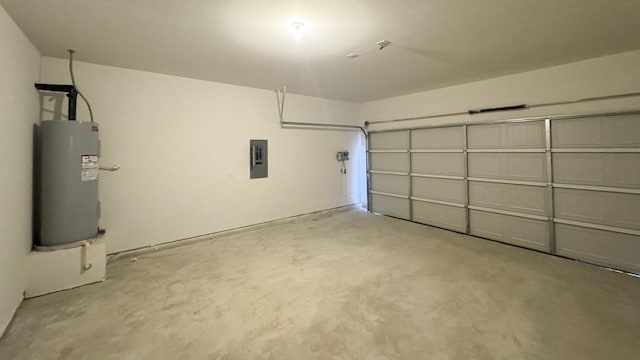 garage featuring electric panel and water heater