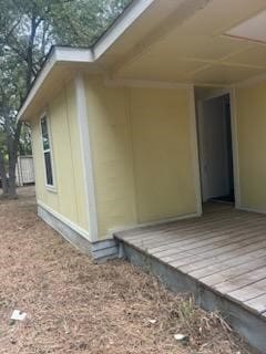 view of property exterior with a deck