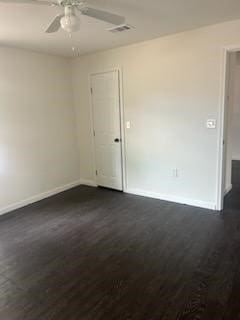 unfurnished room featuring dark wood-type flooring and ceiling fan