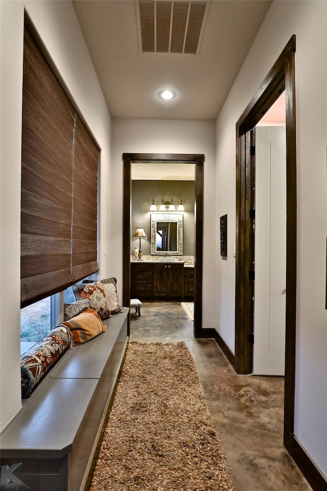 hallway with concrete flooring