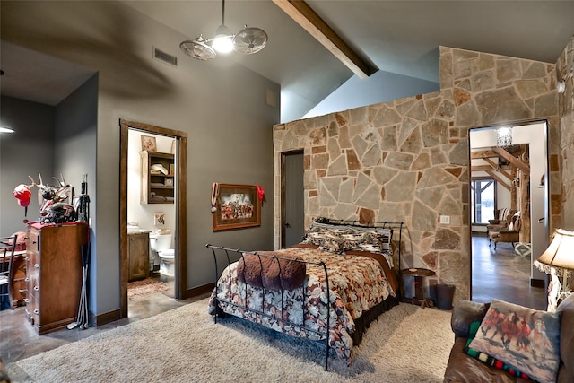 bedroom with beamed ceiling, ensuite bathroom, and high vaulted ceiling