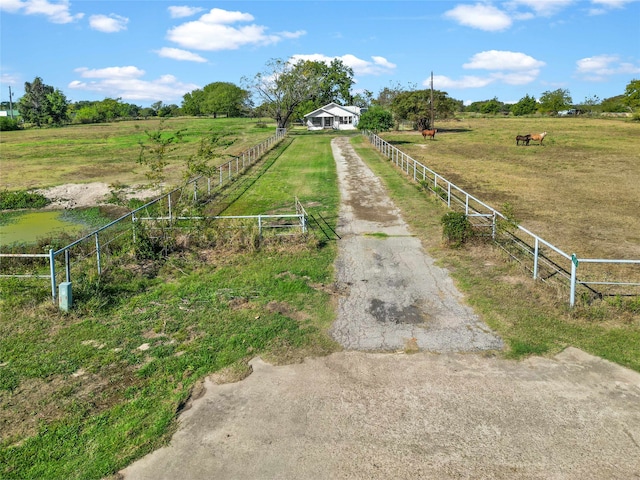 view of yard with a rural view