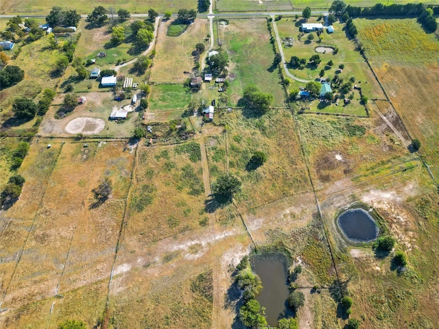 bird's eye view with a water view and a rural view