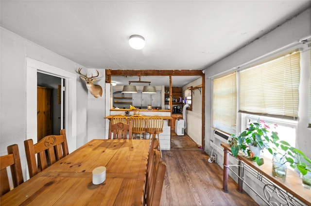 dining room with wood-type flooring