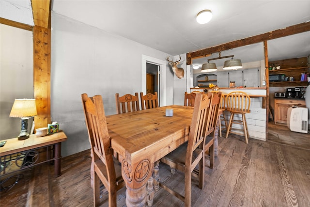 dining space with dark hardwood / wood-style floors