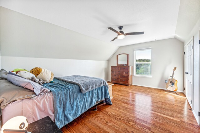 bedroom featuring ceiling fan, a closet, and hardwood / wood-style floors