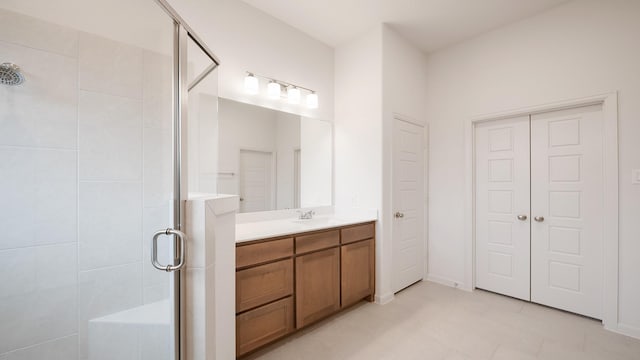 bathroom with vanity and walk in shower