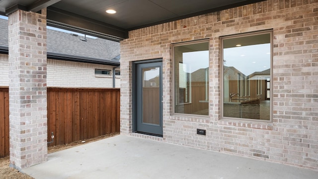 property entrance with a patio area