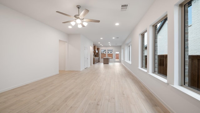 interior space featuring light hardwood / wood-style floors and ceiling fan