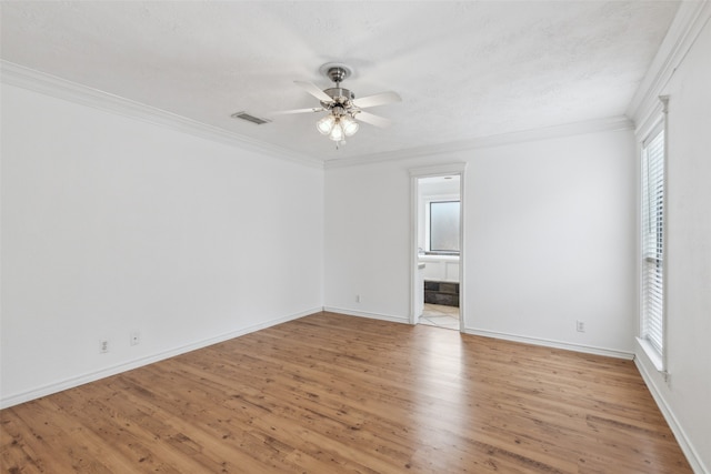 unfurnished room featuring light wood-type flooring, crown molding, and ceiling fan