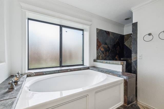 bathroom with crown molding, plenty of natural light, and separate shower and tub