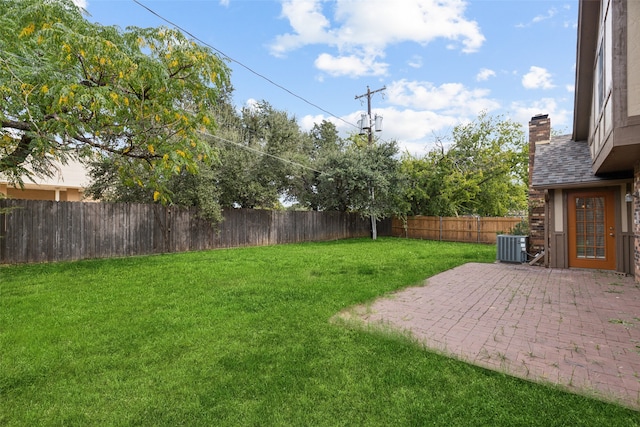 view of yard with a patio and central AC