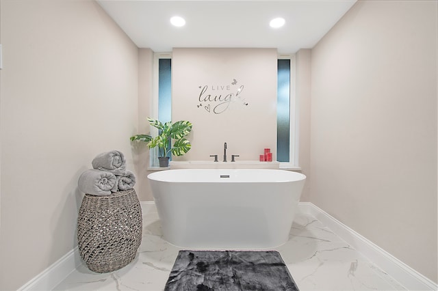 bathroom with a tub to relax in