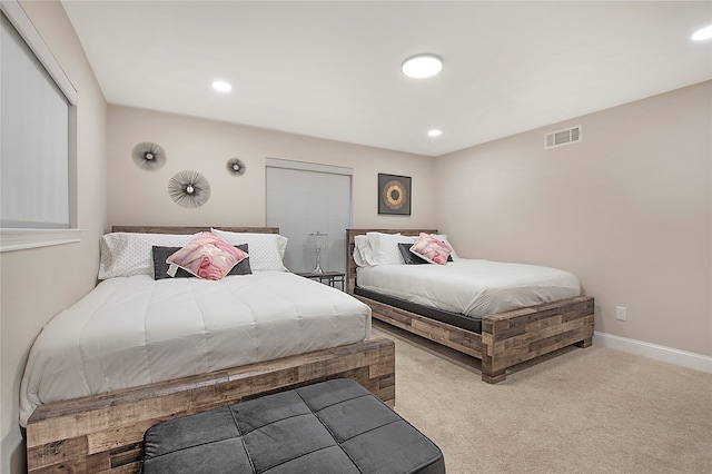 bedroom with light colored carpet