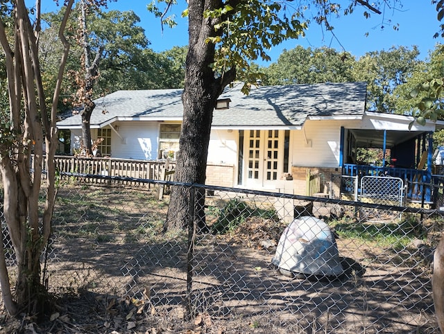 rear view of house with a carport