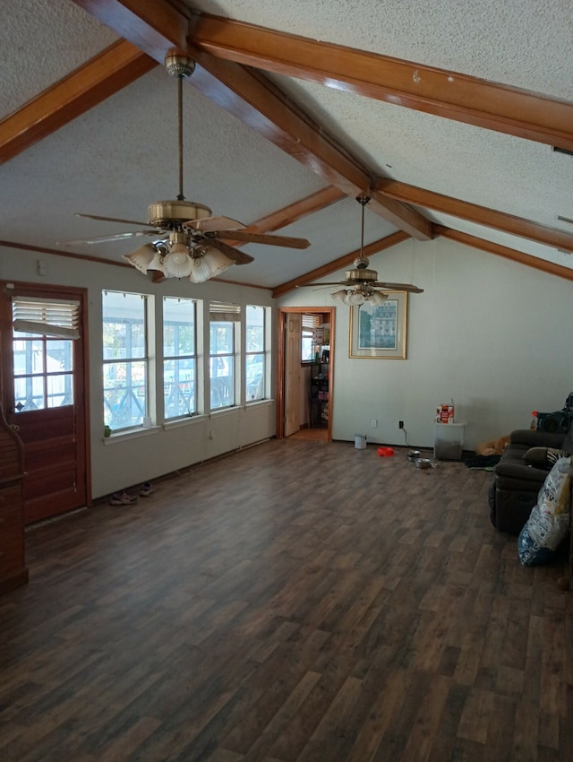 unfurnished living room featuring ceiling fan, a textured ceiling, lofted ceiling with beams, and dark wood-type flooring