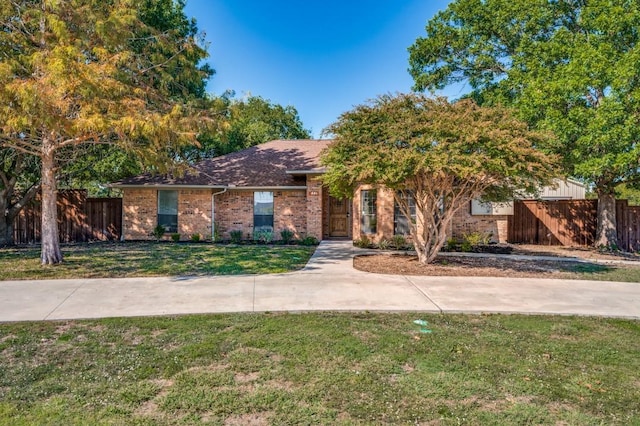 ranch-style house featuring a front lawn