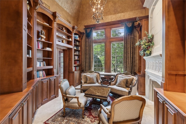 sitting room with light tile patterned floors, high vaulted ceiling, and an inviting chandelier