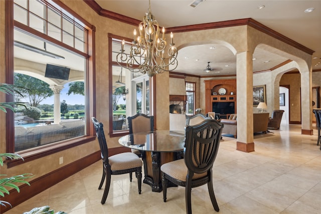 tiled dining area featuring crown molding and a notable chandelier